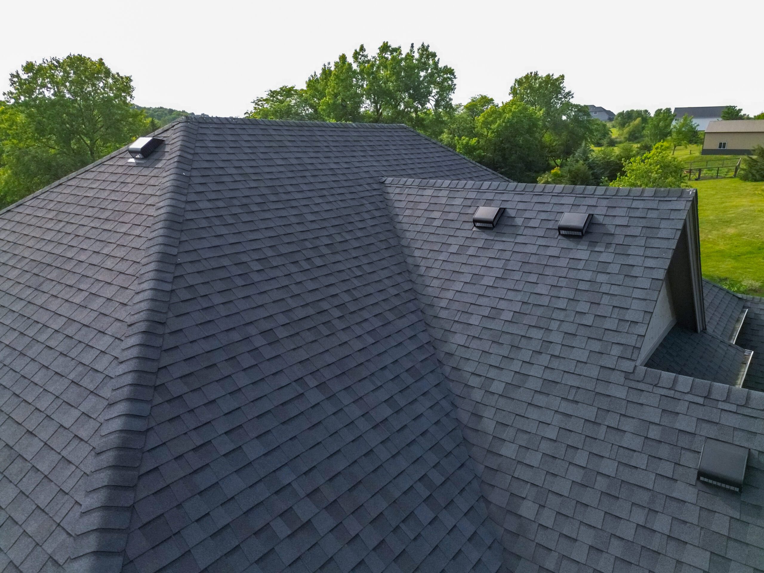 Left-side aerial view of roof replacement by Wolf Roofing in Norwalk