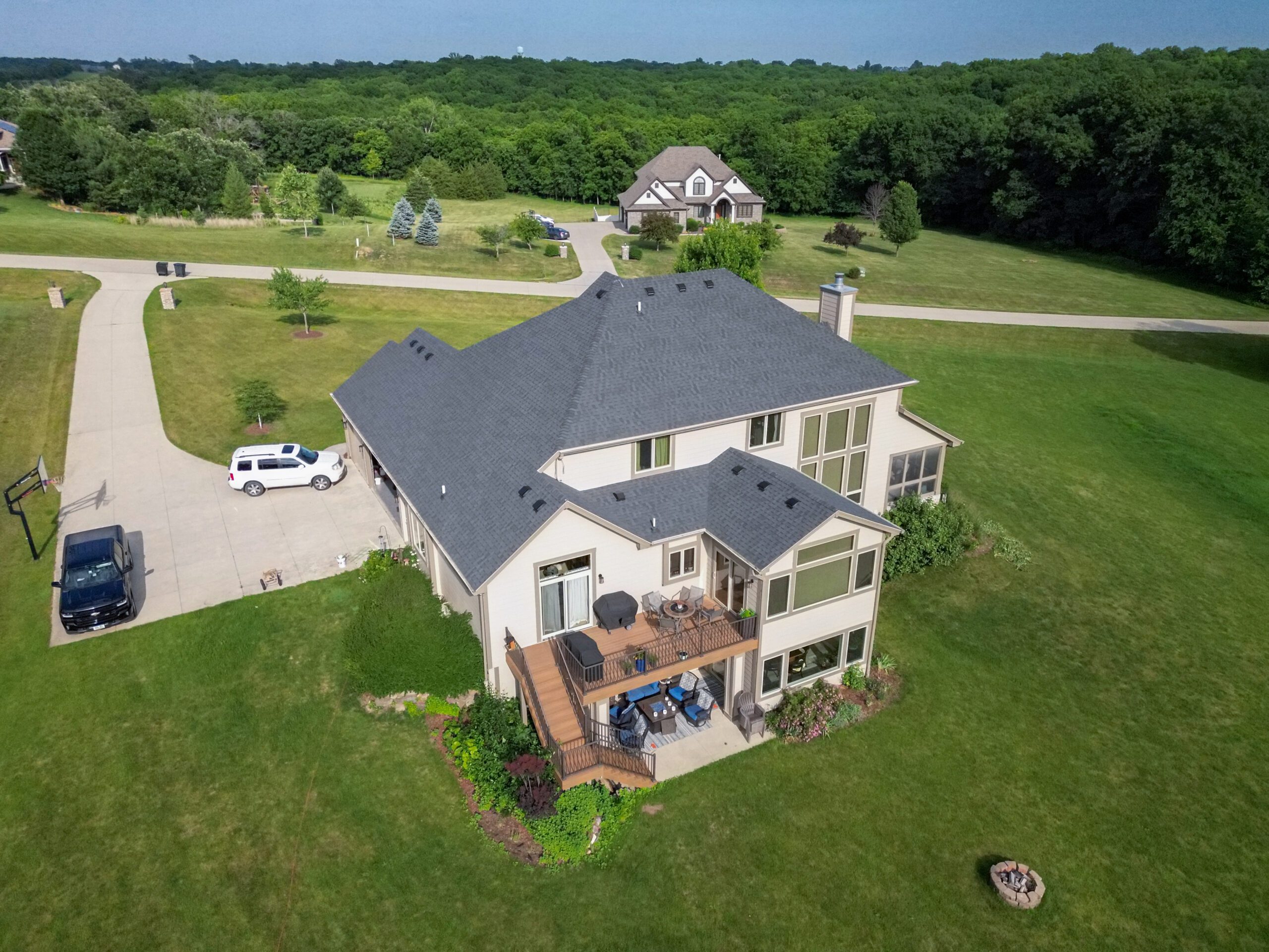 Rear aerial view of full residential roof installed by Wolf Roofing