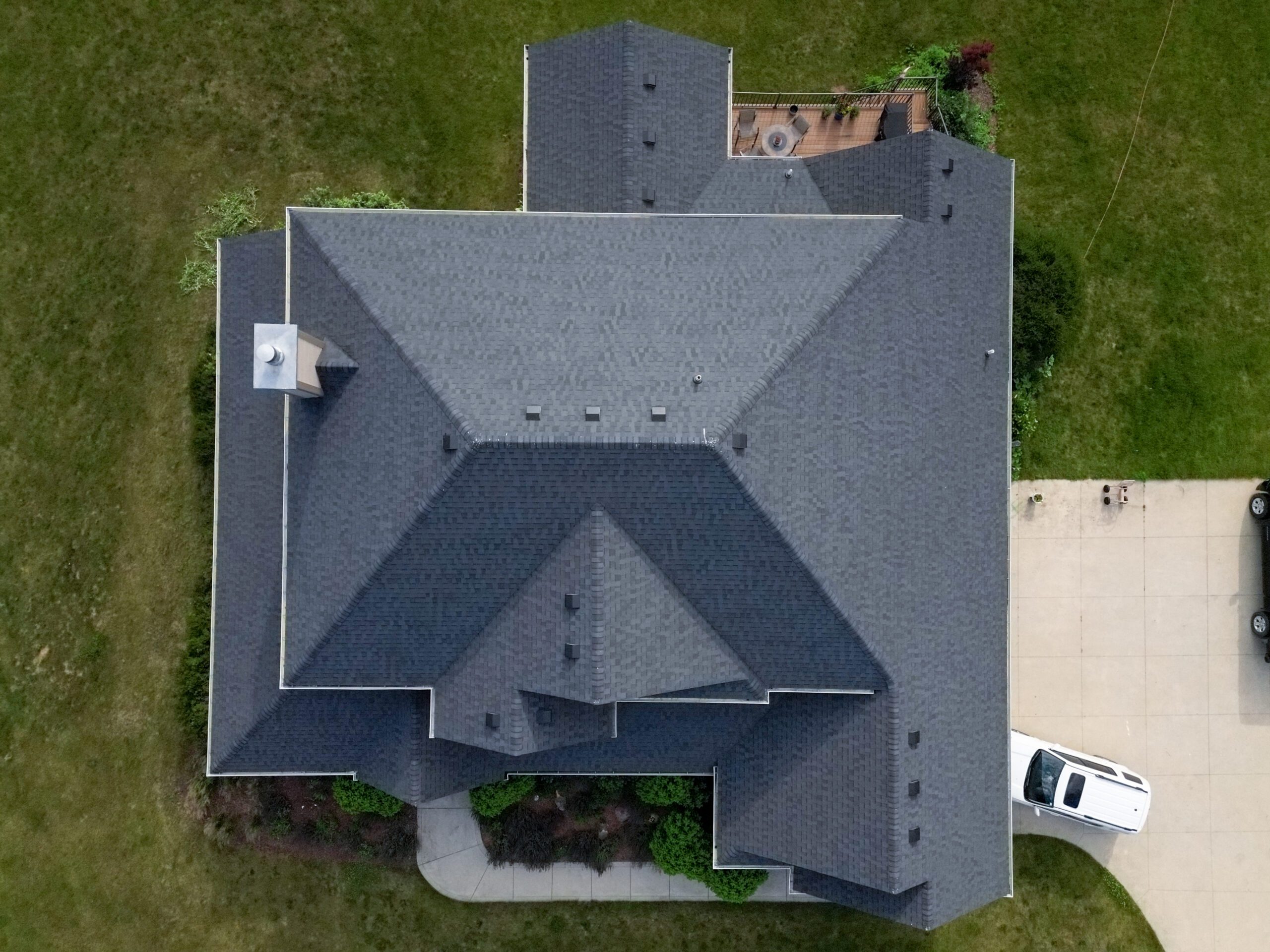 Top-down drone view of full roof installed by Wolf Roofing