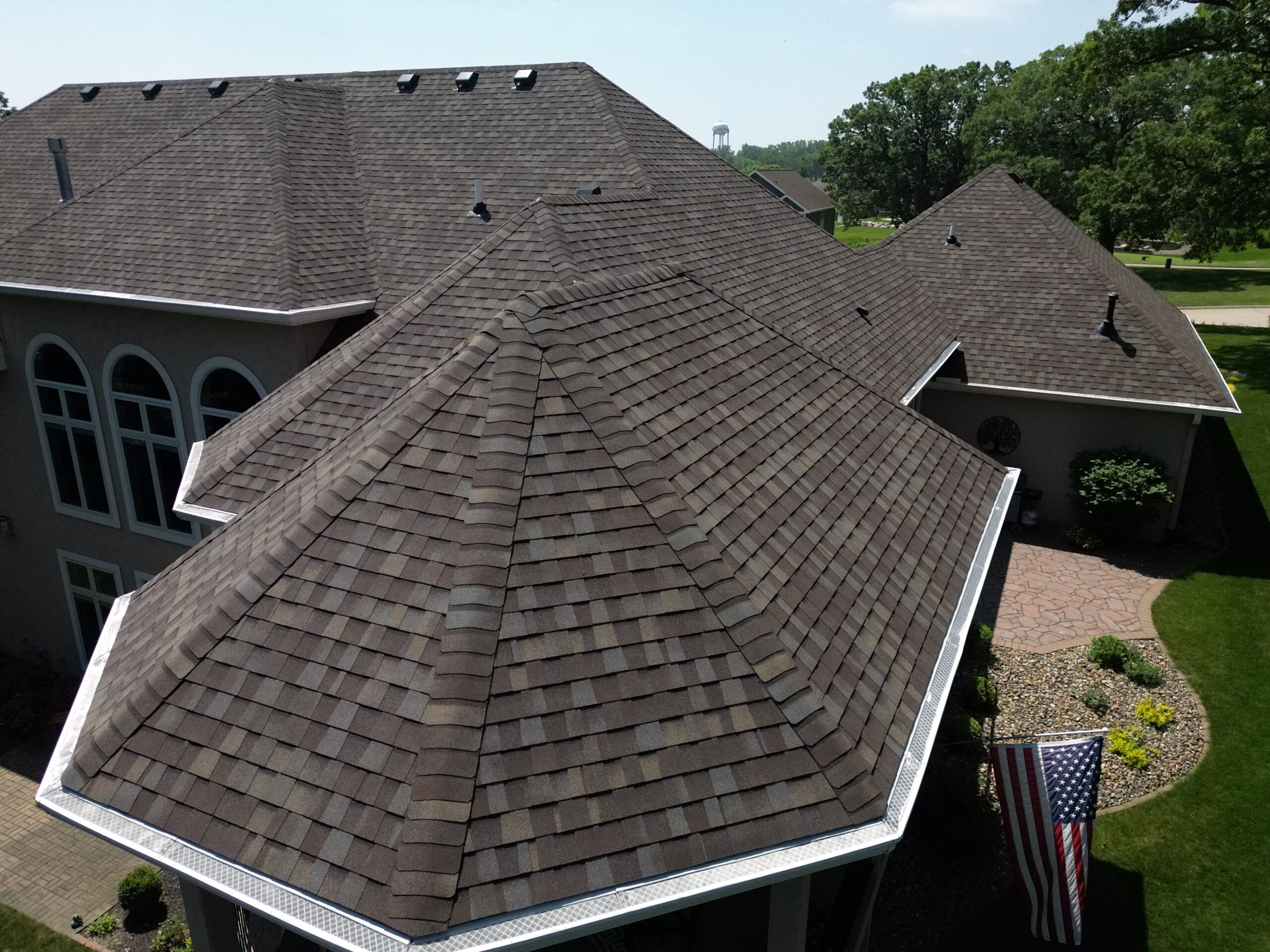 Aerial backyard angle of Polk City home showing completed roofing project by Wolf Roofing