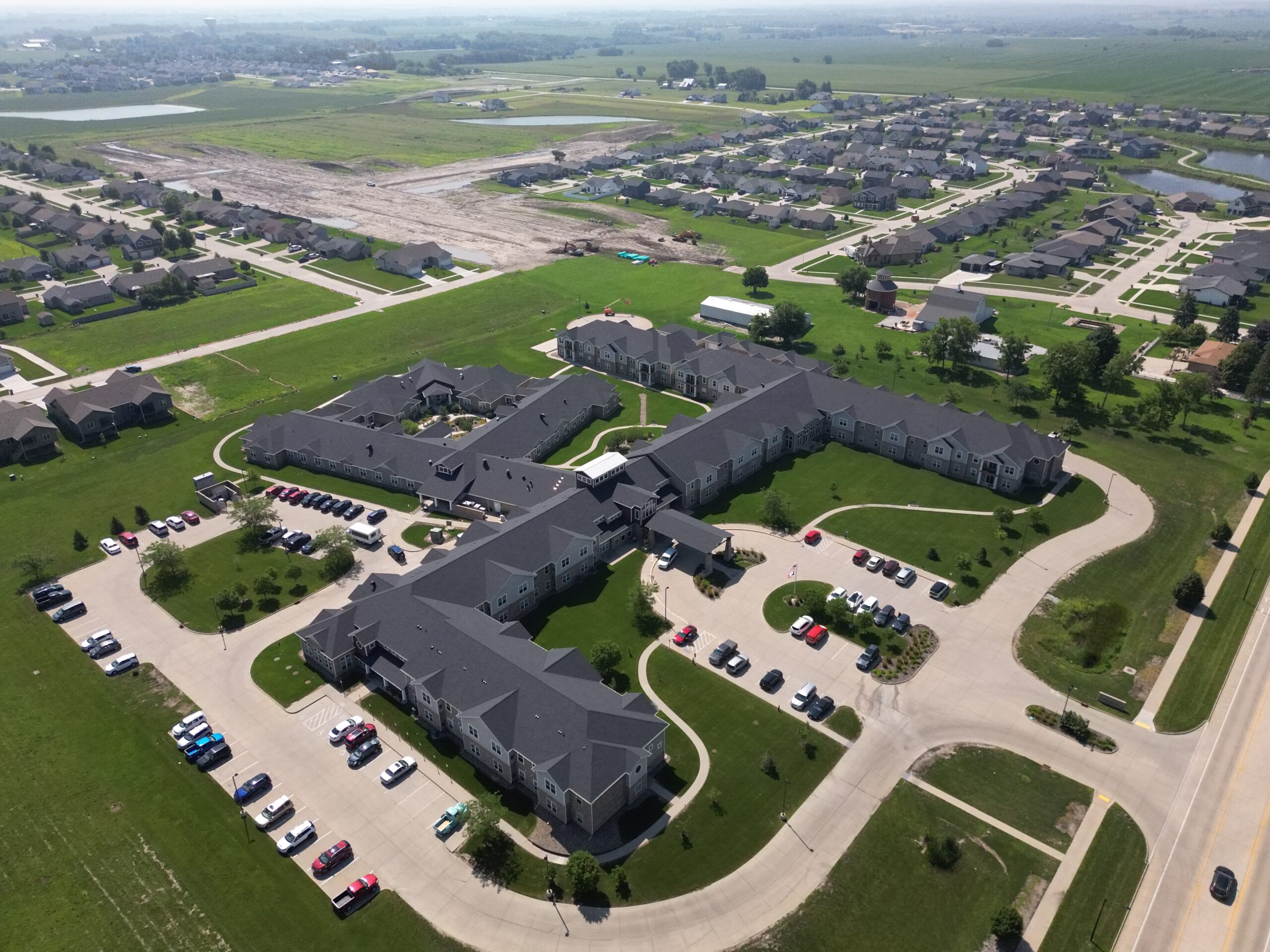 Angled aerial view of Prairie Vista Village showing interconnected roof sections