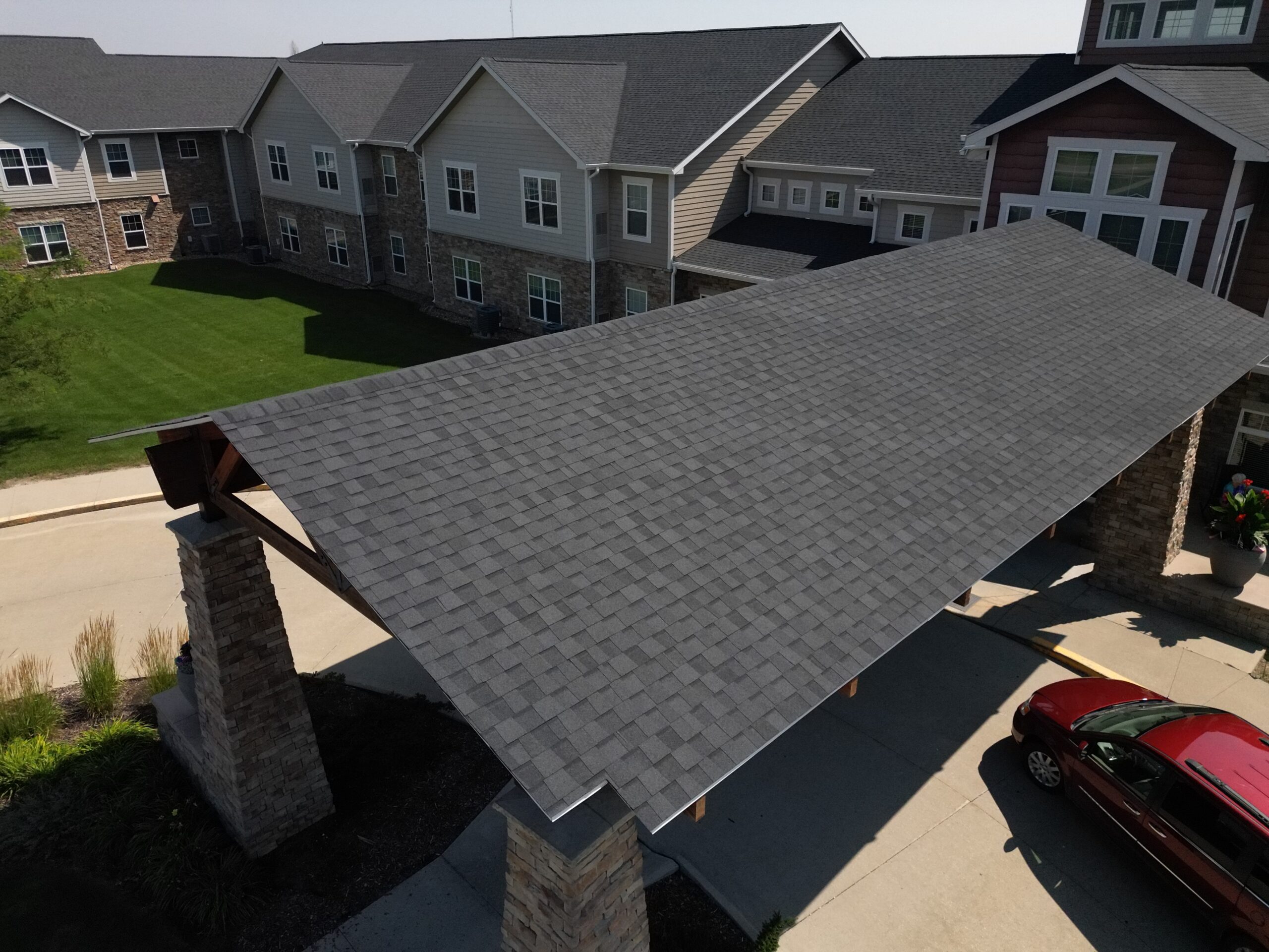 Close-up of entrance cover roof at Prairie Vista with asphalt shingles