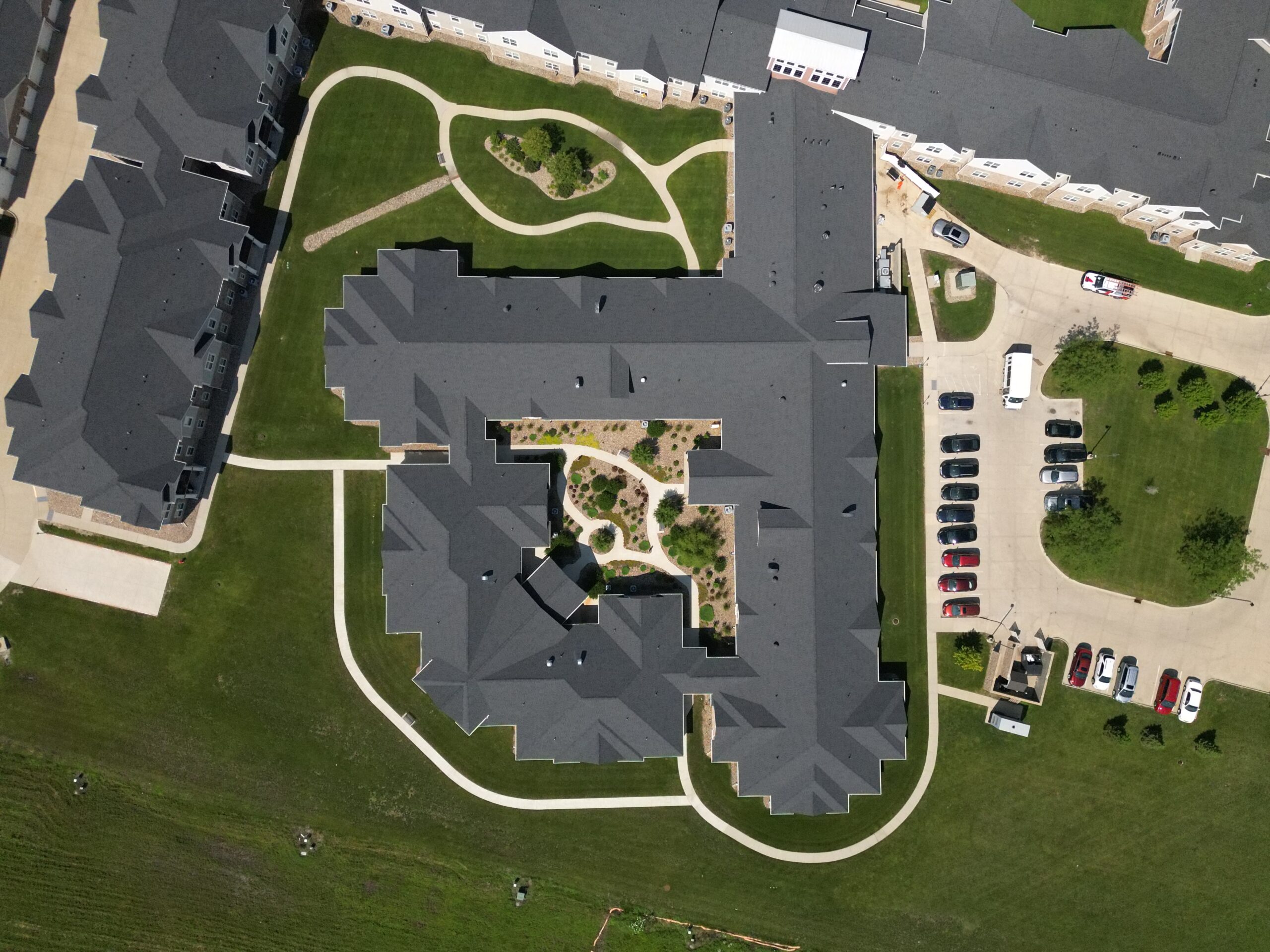 Top-down drone view of Prairie Vista Village showing roof layout and courtyard