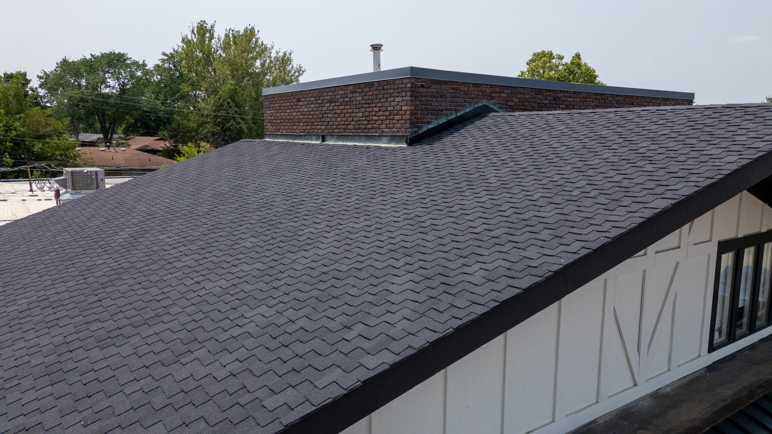 Close-up angled view of Sherwood Forest roof with new CertainTeed shingles by Wolf Roofing