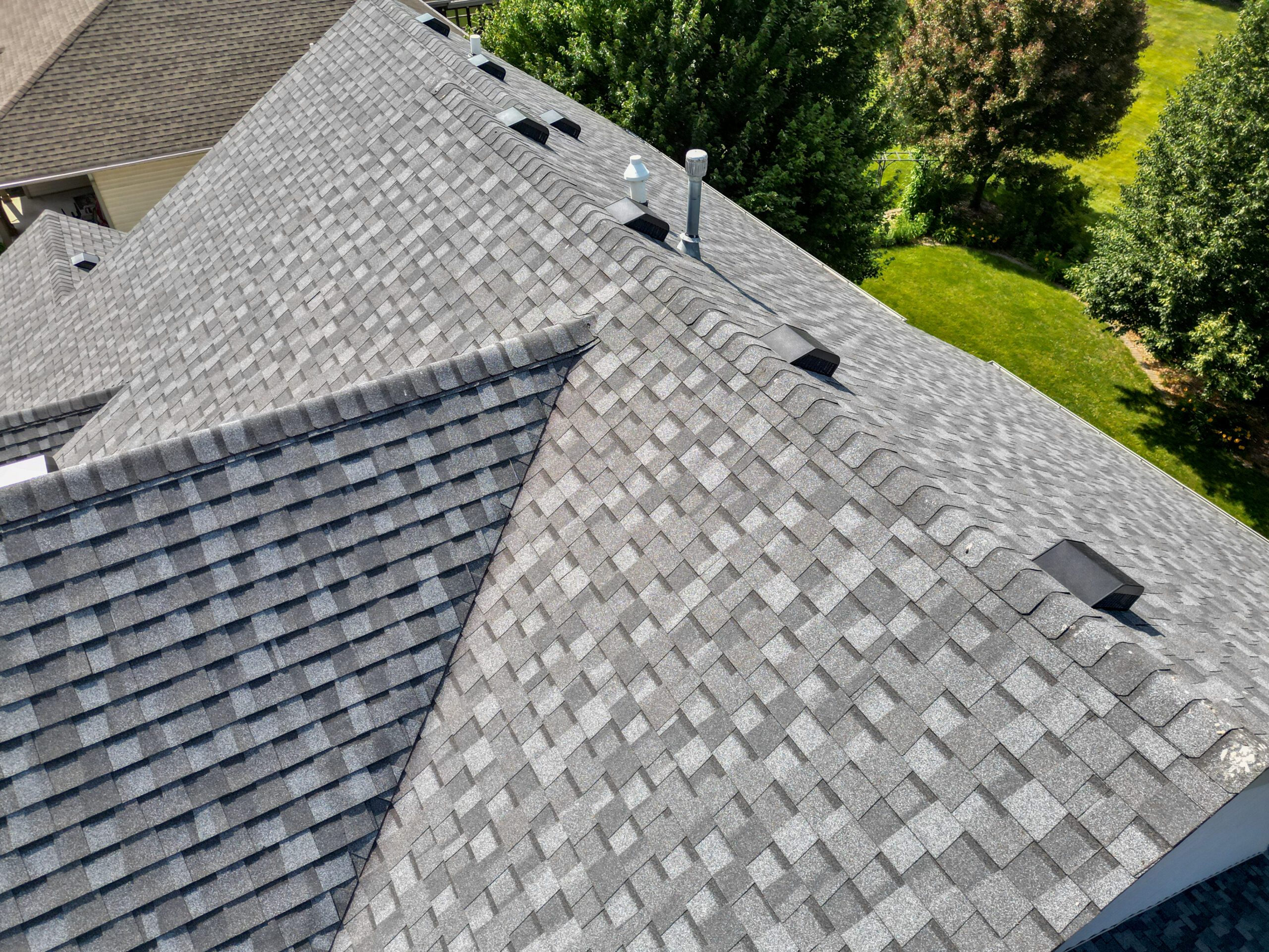 Close-up aerial angle showing intersecting roof lines and quality craftsmanship