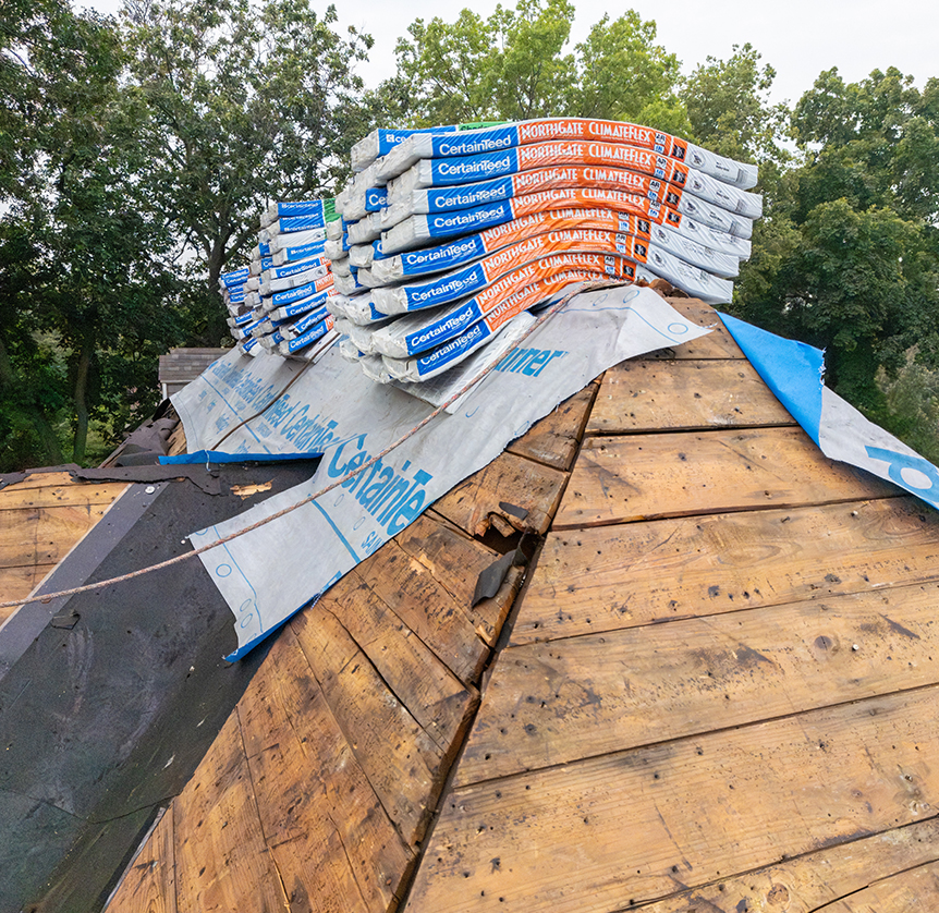 Shingles on a roof ready for replacing by Wolf Roofing