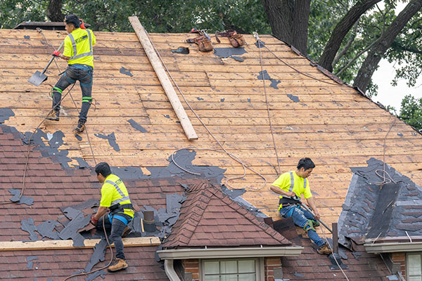 Wolf Roofing workers replacing a roof in Central Iowa