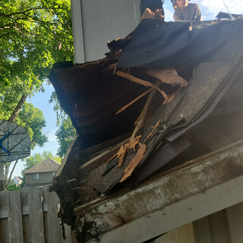damaged-roof A badly damaged roof after a storm