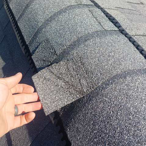 lifting-shingle shingles loosened after storm damage