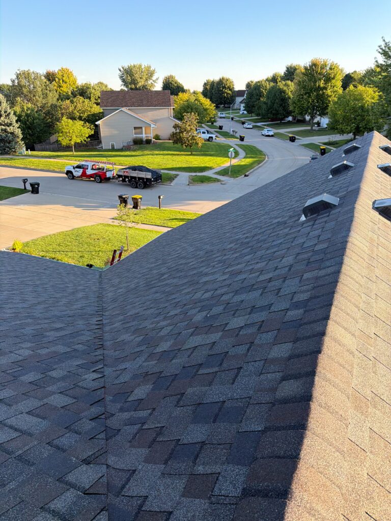 Driftwood Architectural Shingle Roof, Waukee Neighborhood Driftwood architectural shingles across the roof valley of a Waukee twin home
