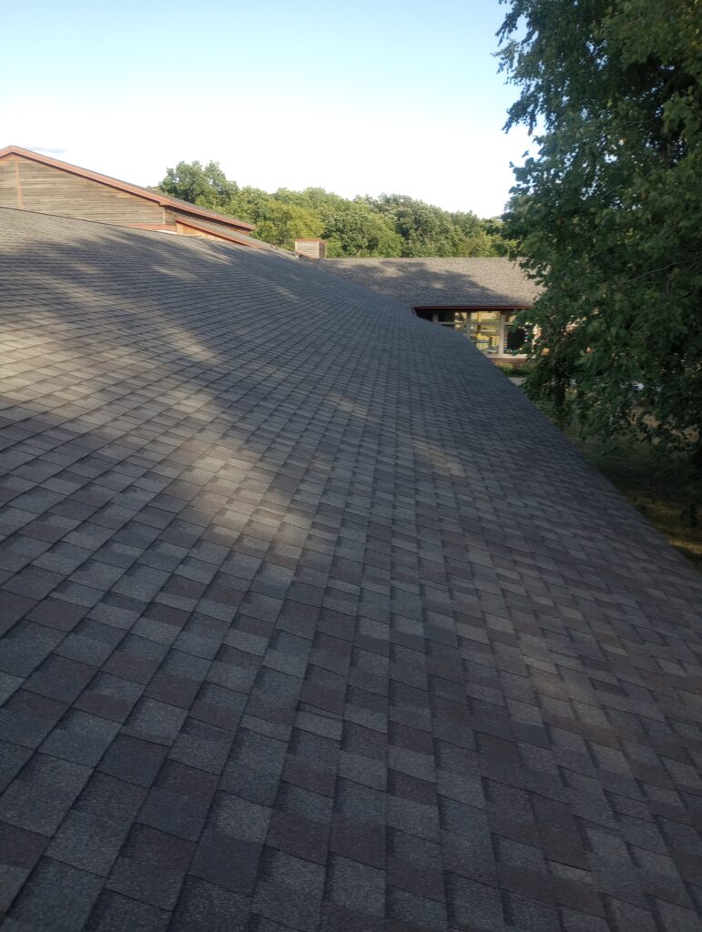 johnston-ia-commercial-shingle-roof-completed Completed commercial shingle roof replacement in Johnston, IA