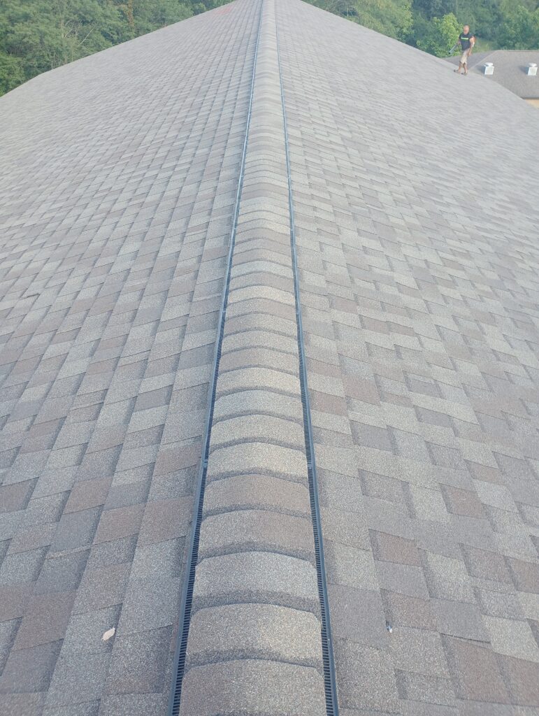 johnston-ia-community-center-new-roof-ridge-cap New ridge cap on a CertainTeed Landmark shingle roof in Johnston, IA