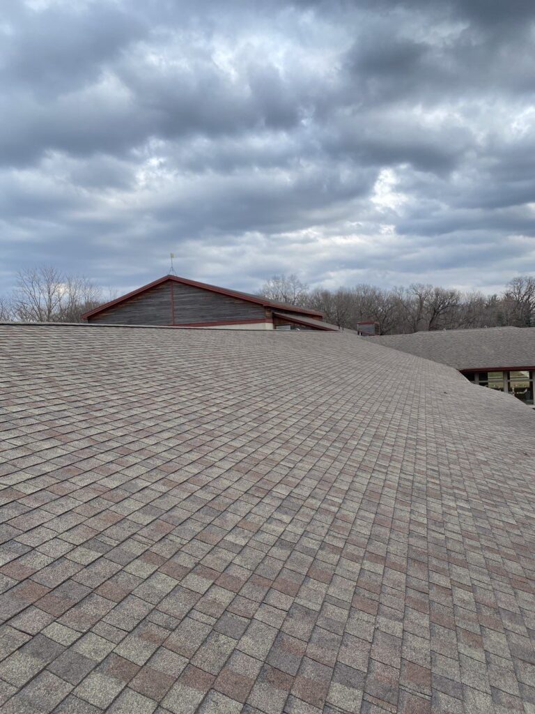 johnston-ia-community-center-old-shingle-roof-before Original shingle roof on a Johnston, Iowa community center before replacement