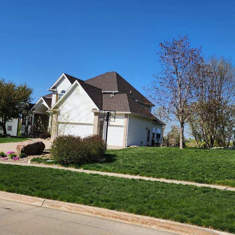 Johnston Home After Roof Replacement Front of a Johnston, IA home after its roof replacement