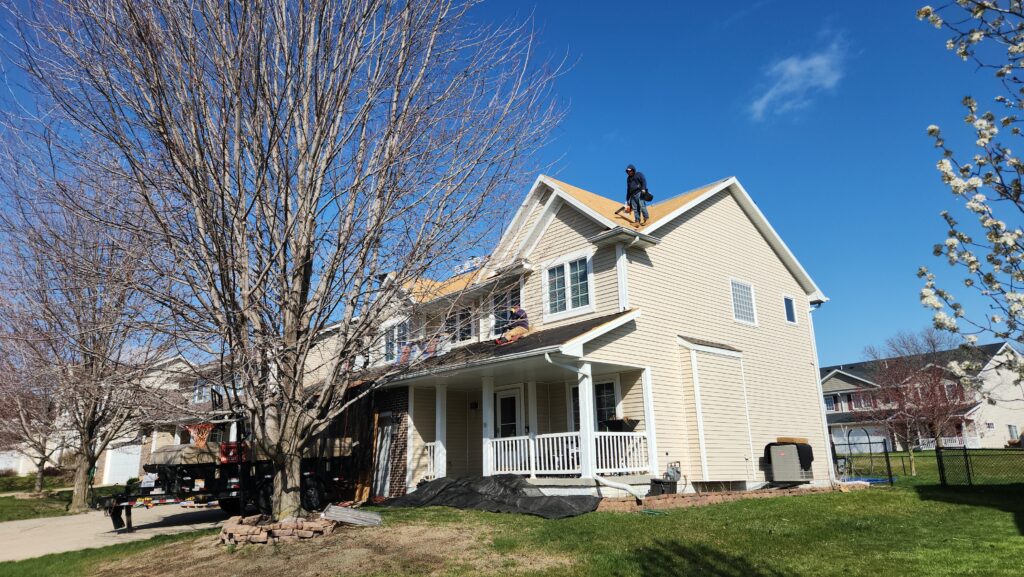 Wolf Roofing crew completing a one-day roof replacement in Ankeny