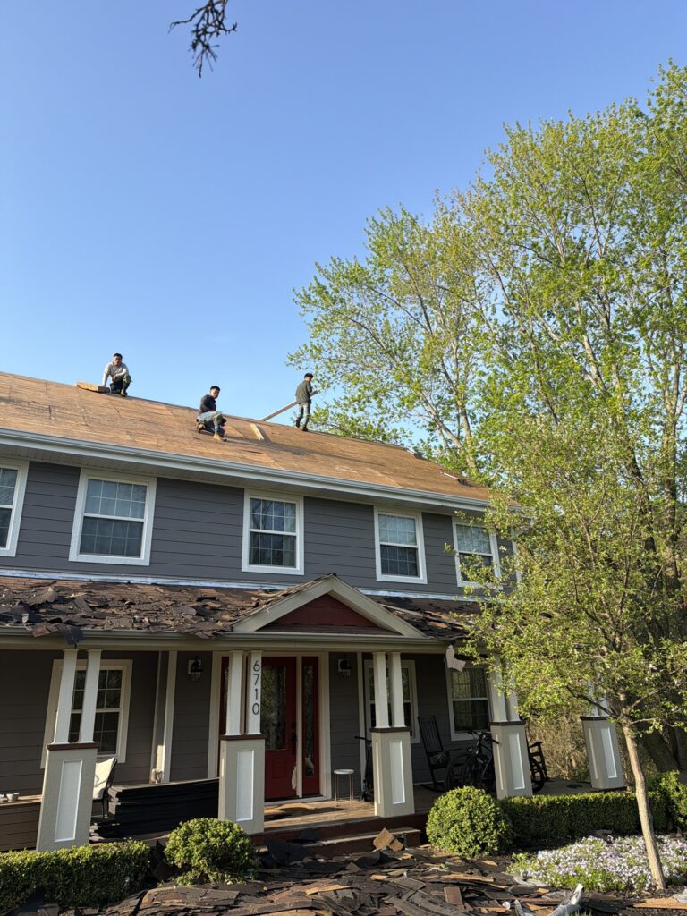 One-Day Roof Replacement West Des Moines Wolf Roofing crew completing a one-day roof replacement in West Des Moines