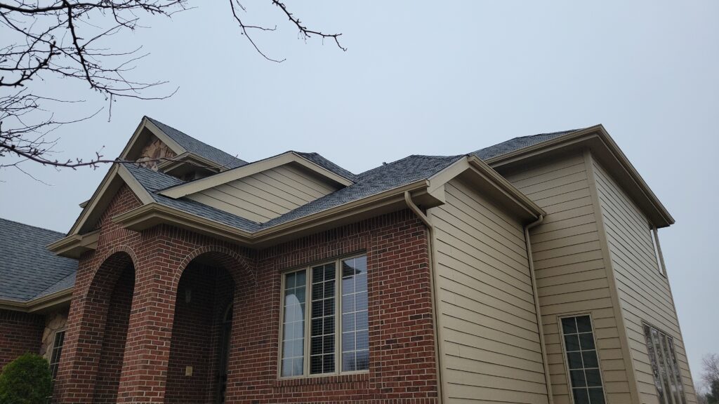 Red Brick Stone Arches, New Roof, Waukee Red brick and stone arches beneath a new Colonial Slate roof in Waukee