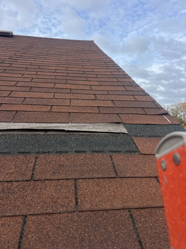Old Red Shingles Before Old red shingles on a West Des Moines home before replacement