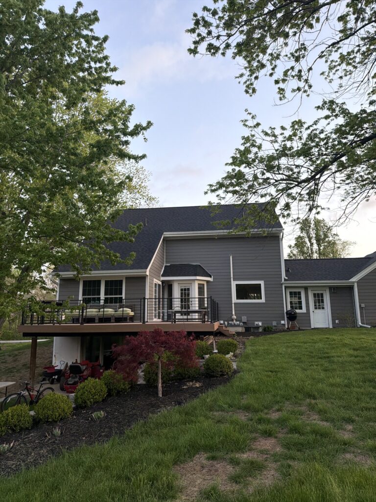 Wooded Home New Roof Back View Back of a wooded West Des Moines home after its roof replacement