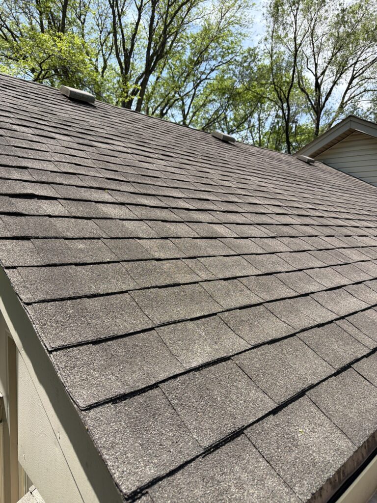 Worn Shingles Before Replacement Worn shingles on a West Des Moines, IA home before replacement
