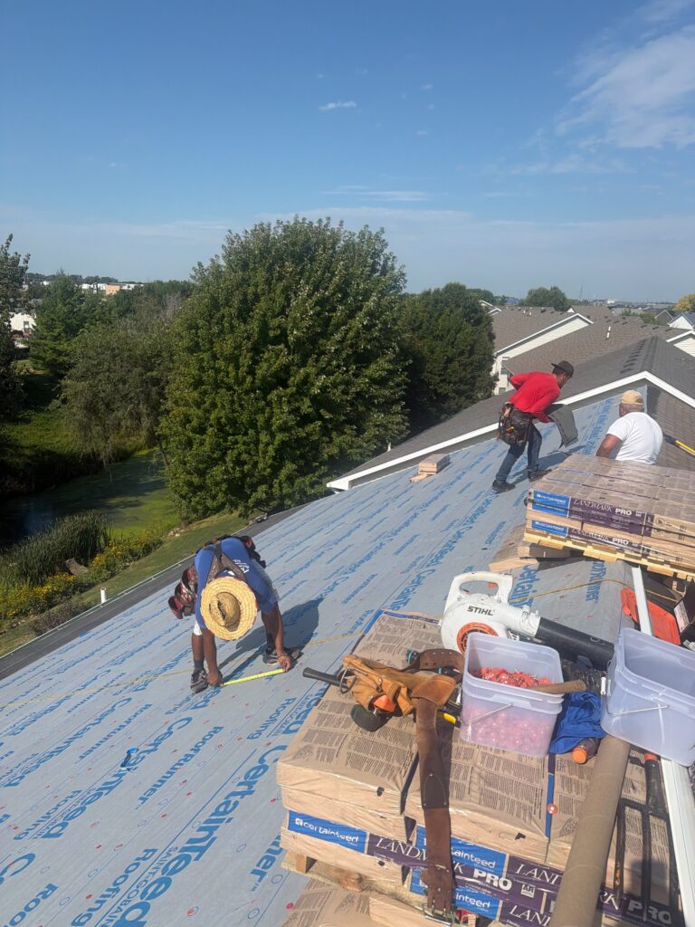 Wolf Roofing Crew Installing New Roof, Waukee Wolf Roofing crew installing a new roof on a Waukee twin home